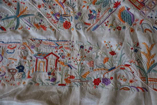 A Chinese embroidered silk table cover, late Qing dynasty, 153cm square excluding fringe